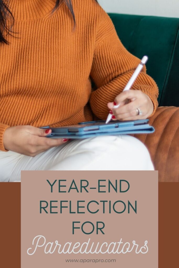 a woman doing a year-end reflection on her tablet. 